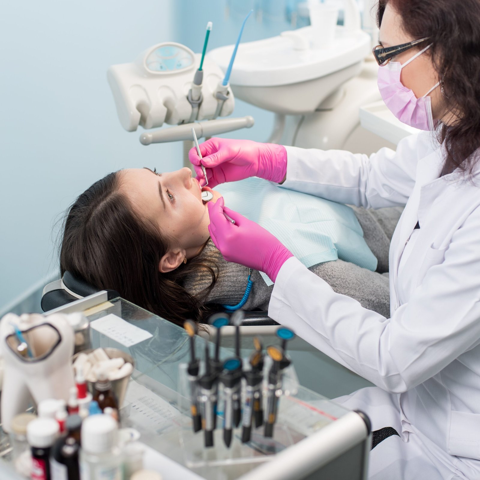 female dentist with dental tools mirror and prob 2025 01 16 22 29 06 utc 1 scaled