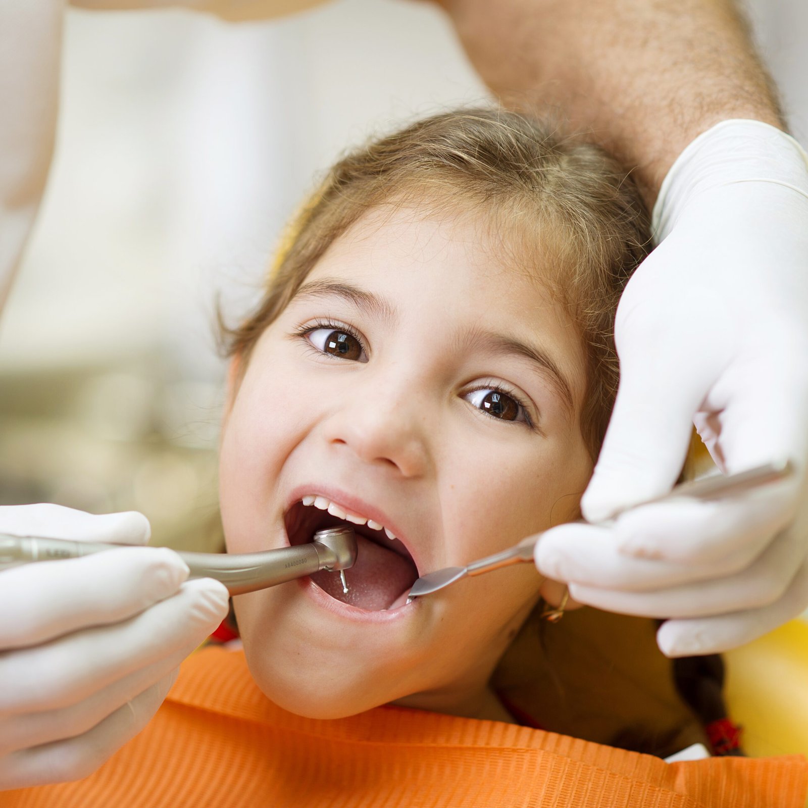 little girl is having her teeth examined by dentis 2025 10 03 04 48 18 utc 1 scaled